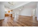 Bright and airy living room with wood flooring and open floor plan to kitchen at 29443 Zeller Ave, San Antonio, FL 33576