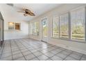 Bright sunroom with tile flooring, natural light, and access to the outdoors at 29443 Zeller Ave, San Antonio, FL 33576