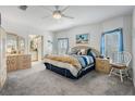 Cozy bedroom featuring plush carpet, white trim, and bright natural light at 37508 Gill Ave, Zephyrhills, FL 33541
