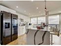 Stylish kitchen boasts stainless steel appliances, granite island and eat-in breakfast bar at 400 Island Way # 612, Clearwater Beach, FL 33767