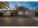 Charming single-story home with a well-manicured front yard and attached garage at 6840 Mesa Verde St, Port Richey, FL 34668