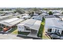 Aerial view of a well maintained single Gathering home with carport in a quiet community at 7133 El Matador St, Zephyrhills, FL 33541