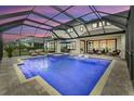 Enclosed pool with in-ground hot tub and ample patio space for relaxing and entertaining at 8414 Eagle Brook Dr, Land O Lakes, FL 34638