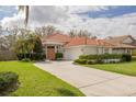 Lovely single story home with well maintained lawn and a paved driveway at 872 Live Oak Ne Ter, St Petersburg, FL 33703