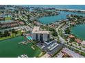 Aerial view of the condo and community with easy access to boat slips, parking, and a community pool at 10355 Paradise Blvd # 909, Treasure Island, FL 33706