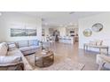 Open-concept living room flows into the kitchen with tile floors at 10622 Farm Hill Ave, Land O Lakes, FL 34638