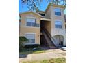 Exterior view of the building with stairs leading to the units, well maintained grounds at 5125 Palm Springs Blvd # 1101, Tampa, FL 33647
