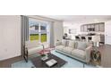 Bright living room featuring modern furniture, neutral colors, and large windows showcasing the outdoor view at 5243 Salt Marsh Rd, Wimauma, FL 33598