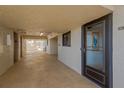 Hallway with a view of unit 307 and other units with exterior access at 6009 Sea Ranch Dr # 307, Hudson, FL 34667