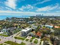 Stunning aerial view of a residential area, with lush greenery and beautiful homes near the water at 735 Snell Isle Ne Blvd, St Petersburg, FL 33704