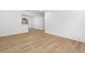 Spacious living room featuring wood floors and ample natural light at 1212 E Crawford St, Tampa, FL 33604
