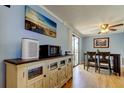Bright dining area with sliding glass doors leading to an outdoor area at 136 Sycamore Ln # C, Oldsmar, FL 34677