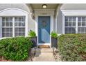 A well-maintained front door adorned with a wreath at 2352 Lake Woodberry Cir, Brandon, FL 33510