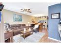 A living room and dining area with hardwood floors and comfortable furniture at 2352 Lake Woodberry Cir, Brandon, FL 33510