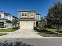 Beautiful two-story home with a spacious driveway and well-maintained landscaping at 29011 Trevi Pl, Wesley Chapel, FL 33543