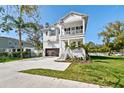Attractive two-story home with a two-car garage, complemented by lush landscaping at 3201 S Manhattan Ave, Tampa, FL 33629