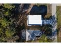 A bird's eye view captures the roof and driveway of a well-kept modern home at 7984 Gulf Way, Hudson, FL 34667