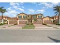 Beautiful exterior of townhomes with brick driveways, garages and lush landscaping at 10800 Tarflower Dr # 202, Venice, FL 34293