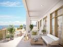 Spacious balcony featuring ample seating, potted plants and ocean views at 126 4Th Ne Ave # 2201, St Petersburg, FL 33701