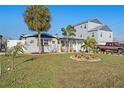 Inviting single-story home with a spacious yard, complemented by mature trees and pleasant landscaping at 13429 Lisa Dr, Hudson, FL 34667
