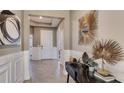 Inviting entryway featuring neutral walls, decorative mirror and foyer table at 19643 Gladeview Way, Land O Lakes, FL 34638