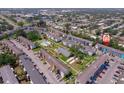An aerial view of the community showcasing the buildings, green spaces, pool, and parking at 2113 Canal Dr # B2, Bradenton, FL 34207