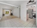 A spacious living room with tile floors and lots of natural light coming through the sliding glass doors at 2113 Canal Dr # B2, Bradenton, FL 34207
