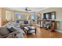 Sun-drenched living room with beautiful bamboo floors, city views and stylish furnishings provides an inviting atmosphere at 501 Mandalay Ave # 601, Clearwater Beach, FL 33767