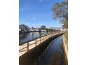 Waterfront community features a wooden dock along the canal with boat parking, waterway views, and lush landscaping at 5618 Baywater Dr # 5618, Tampa, FL 33615