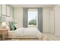 Cozy bedroom featuring a plush bed, large window, and coordinating decor at 9308 Cannon Beach Dr, Parrish, FL 34219