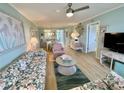 Inviting living room with comfortable seating and a seamless transition to the dining area, perfect for entertaining at 1 Boca Ciega Point Blvd # 213, St Petersburg, FL 33708
