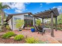 Charming courtyard featuring brick pavers, fire pit and a pergola providing shade at 101 30Th N Ave, St Petersburg, FL 33704