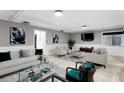 A bright living room featuring modern decor, wainscoting, neutral paint and ample natural light at 101 30Th N Ave, St Petersburg, FL 33704