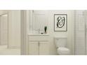 Bathroom with white vanity, contemporary fixtures, toilet, and tiled walk-in shower at 11749 E 74Th Cir, Palmetto, FL 34221