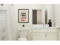 Bright bathroom features shower with glass door, and white vanity with modern fixtures at 11749 E 74Th Cir, Palmetto, FL 34221