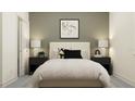 Neutral toned bedroom with a queen-size bed, bedside lamps, and minimalist decor at 11749 E 74Th Cir, Palmetto, FL 34221