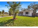 Inviting single-story home boasting a well-kept lawn, a delightful front porch, and charming curb appeal at 1712 25Th N Ave, St Petersburg, FL 33713