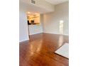 An open concept living room featuring hardwood floors that connects to the kitchen at 1914 E 4Th Ave # 2, Tampa, FL 33605