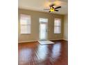 Bright living room featuring hardwood floors, lots of natural light, and a ceiling fan at 1914 E 4Th Ave # 2, Tampa, FL 33605