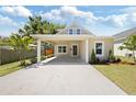 Charming home featuring a covered carport, new landscaping, and craftsman architecture at 23 N Edwards St, Plant City, FL 33563