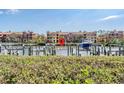 View of the community docks on the water with building in background on a bright sunny day at 2733 Via Cipriani # 814A, Clearwater, FL 33764