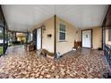 Inviting covered porch with unique tile flooring and ample space for seating at 3001 W Chestnut St, Tampa, FL 33607