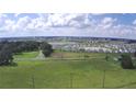 Sprawling view of the community highlighting the nearby pond and ample green space at 32817 Leonard Rd, San Antonio, FL 33576