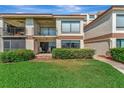 A well-manicured lawn and patio with stylish outdoor seating that enhances the appeal of the condo's exterior at 6268 Palma Del Mar S Blvd # 113, St Petersburg, FL 33715