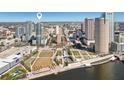 An aerial view of the condo building with a vibrant city skyline backdrop at 777 N Ashley Dr # 915, Tampa, FL 33602