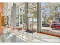 Bright condo lobby with floor-to-ceiling windows and stylish seating at 777 N Ashley Dr # 915, Tampa, FL 33602