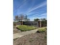 Entrance to Spring Ridge community featuring stone accents and manicured landscaping at 8480 Southern Charm Cir, Brooksville, FL 34613