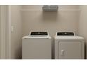 Functional laundry room with a modern washer and dryer set at 9320 Bonita Mar Dr, Parrish, FL 34219