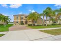 Beautiful two-story home features manicured lawns and elegant curb appeal at 9846 Smarty Jones Dr, Ruskin, FL 33573