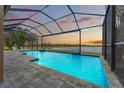 Gorgeous screened pool overlooking the water, perfect for entertaining and relaxing at 9846 Smarty Jones Dr, Ruskin, FL 33573